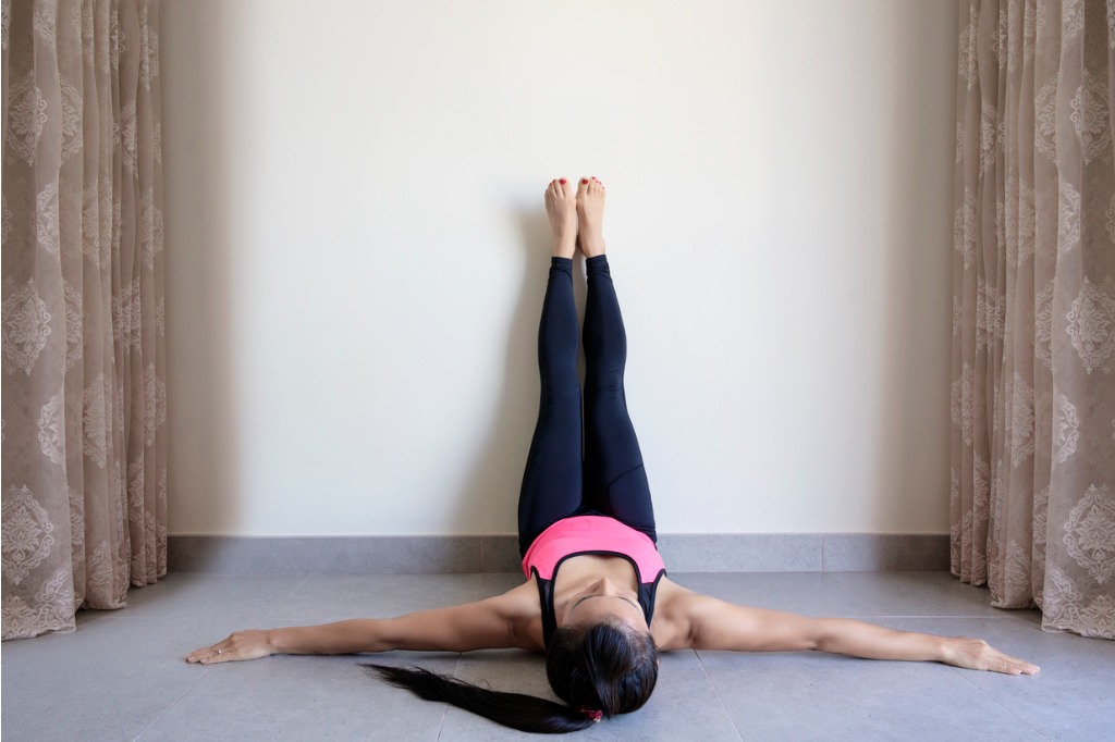 Guide to Stretching Before Bed, Plus Yoga Teacher-Approved Bed Stretches